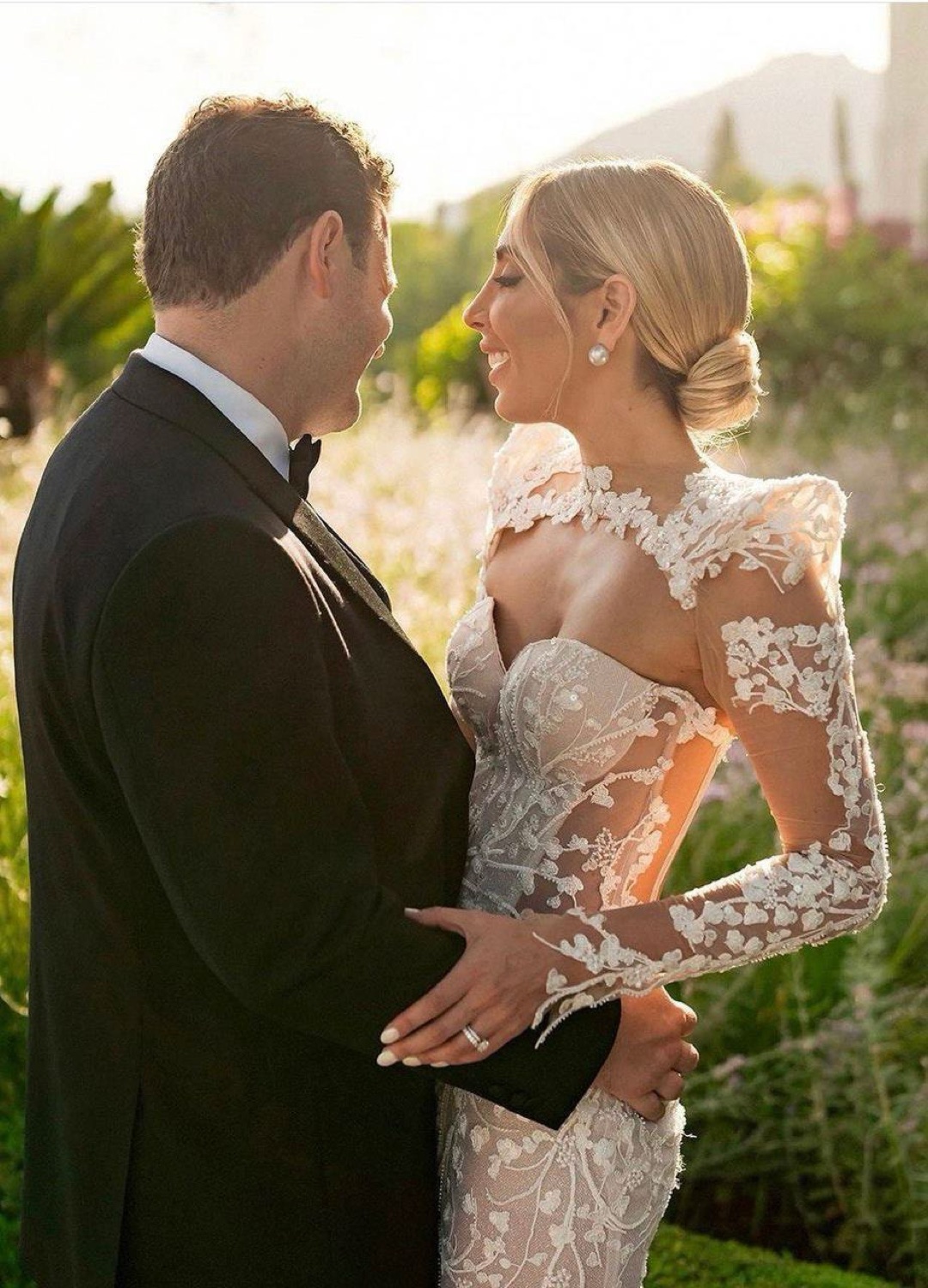 Bride in lace gown with groom